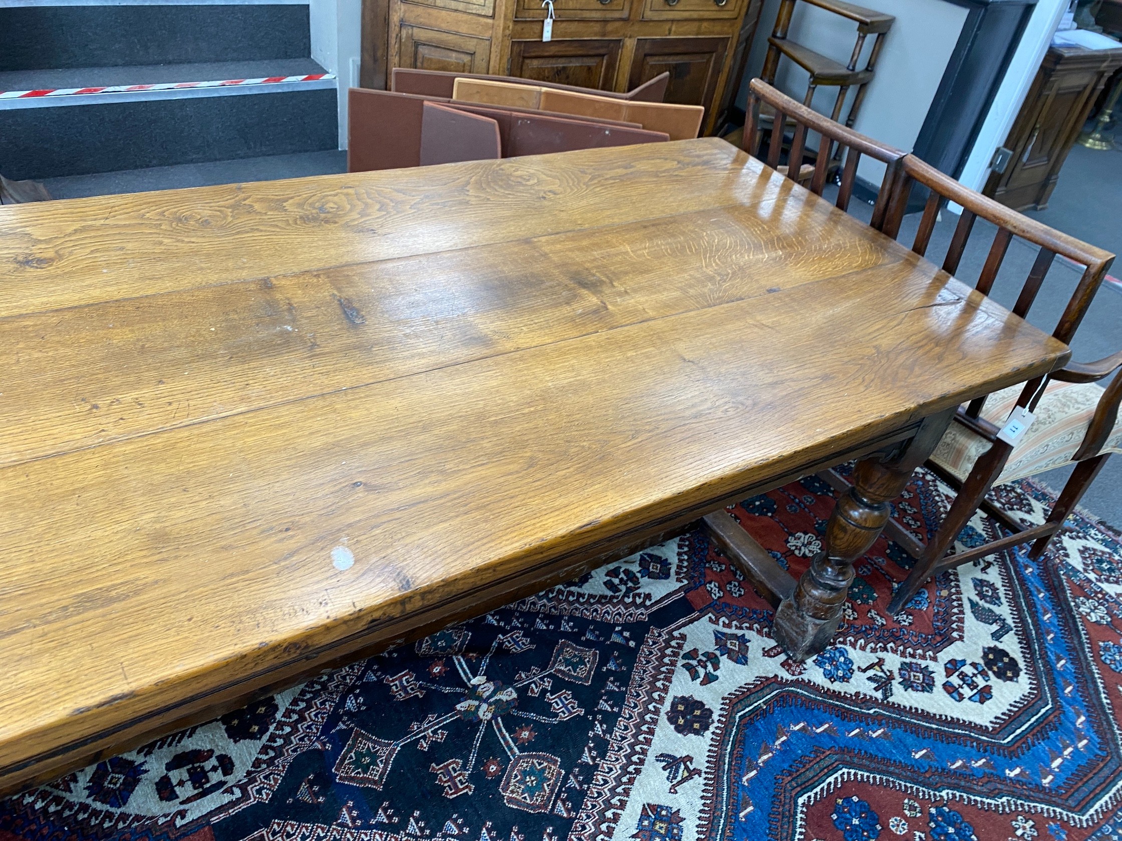 An 18th century style rectangular oak refectory dining table, length 227cm, depth 92cm, height 76cm